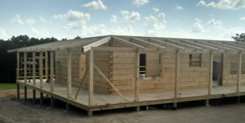 Picture of a log home being constructed